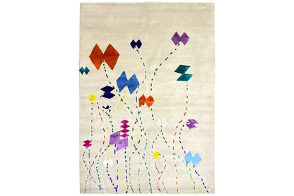 Rectangular beige rug with an abstract pattern of colorful dots