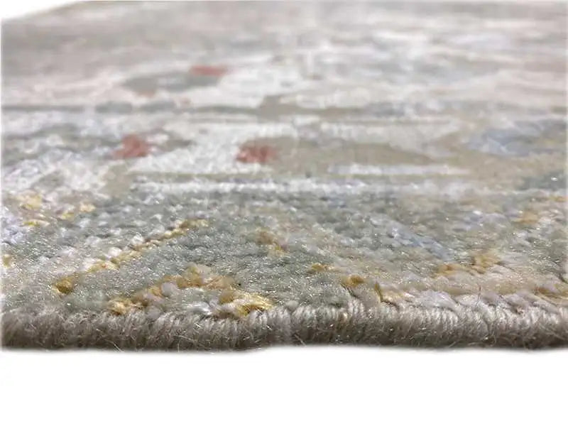 Designer rug with a fluffy pile, patterned in gray, beige, and subtle pops of color