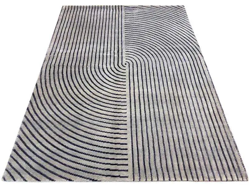 Rug with a gray background and dark blue lines, divided into curved sections