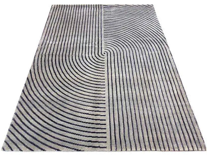Rug with a gray background and dark blue lines, divided into curved sections