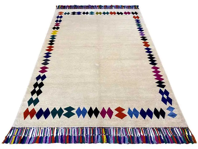 Rug with fringe, large diamond and zigzag border in blue/red/purple