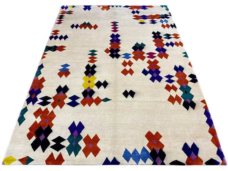 Rug with a colorful geometric pattern on a light background, front view.