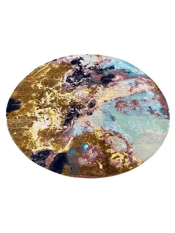 Oval rug with a high-contrast abstract pattern in gold, blue, and cream