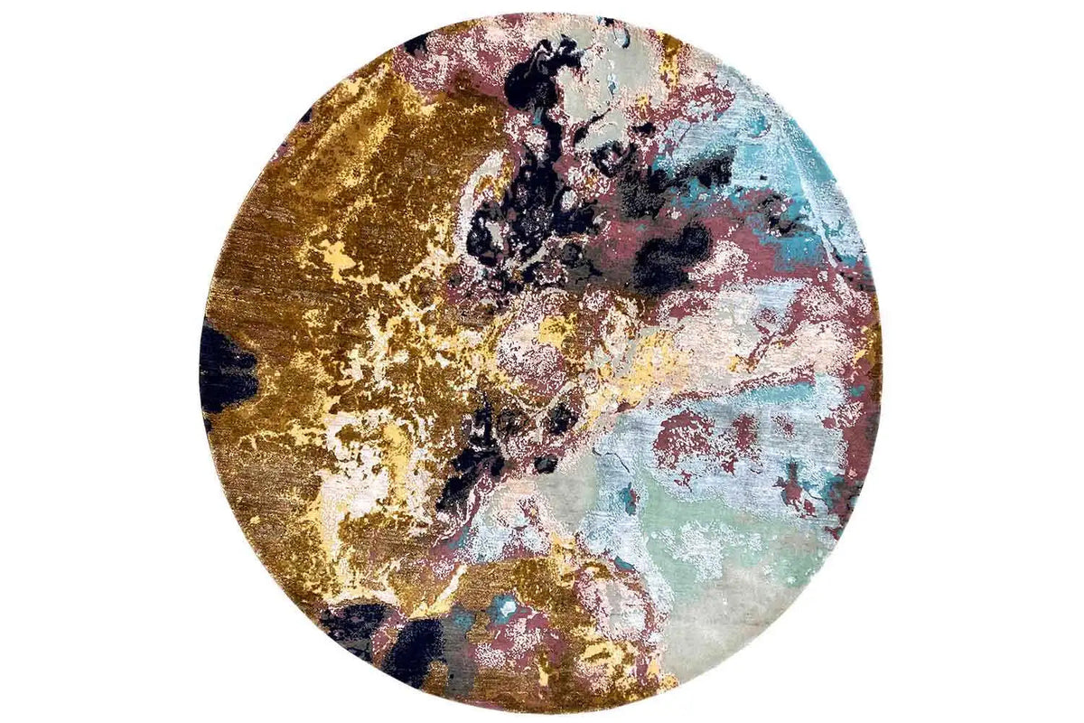 Round rug with an abstract pattern: gold, blue, pink, and light green