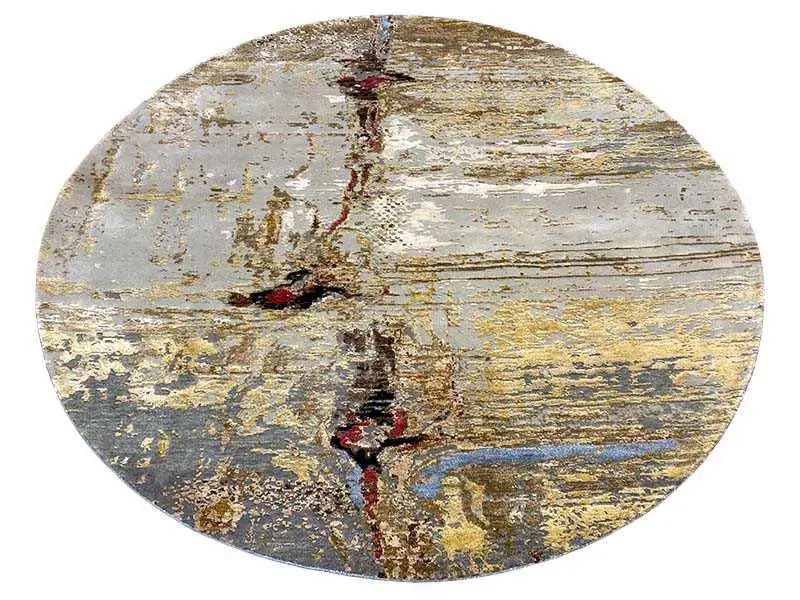 Round modern rug with a gray background, gold lines, and blue accents.