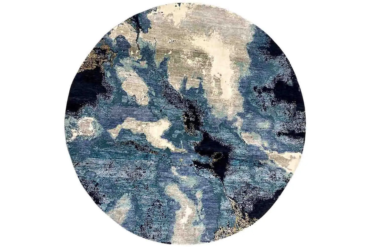 Round designer rug in top view: abstract blue-beige pattern on a light background.