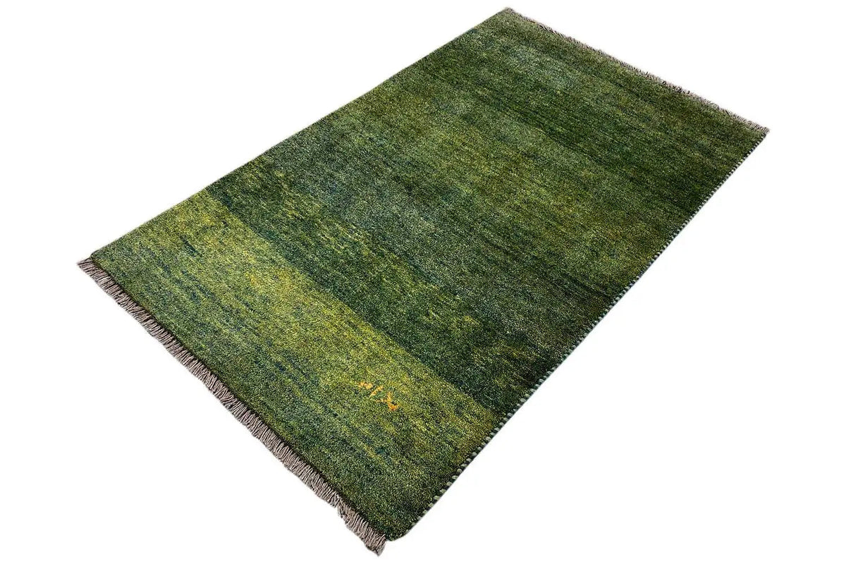 Gabbeh rug with a green-yellow mottled pattern and even fringes