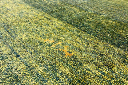 Gabbeh rug surface, green-yellow mélange pattern with a fine texture