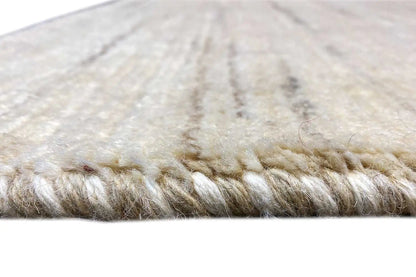 Gabbeh rug: beige pile with short fringes along the edge