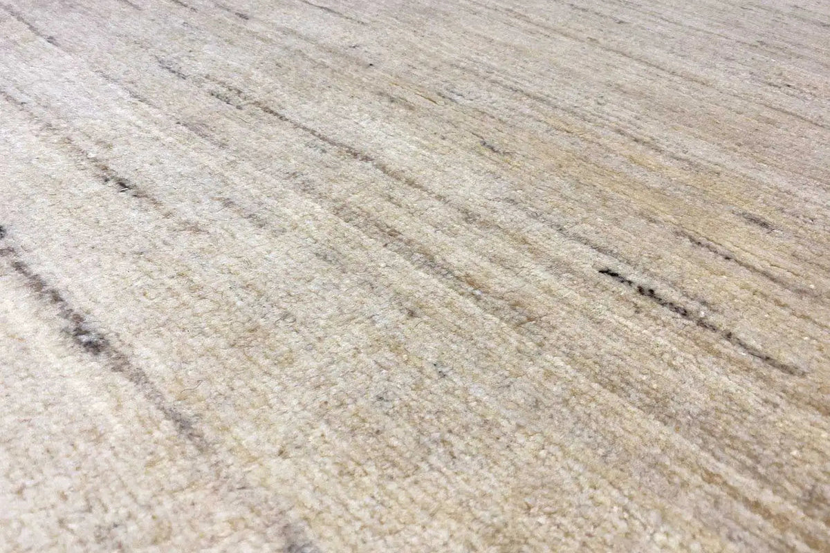 Beige carpet with fine, mottled lines and a short pile texture