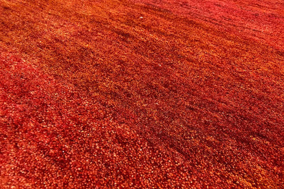Carpet surface in reddish brown, fine fiber pattern with a dense, uniform weave structure