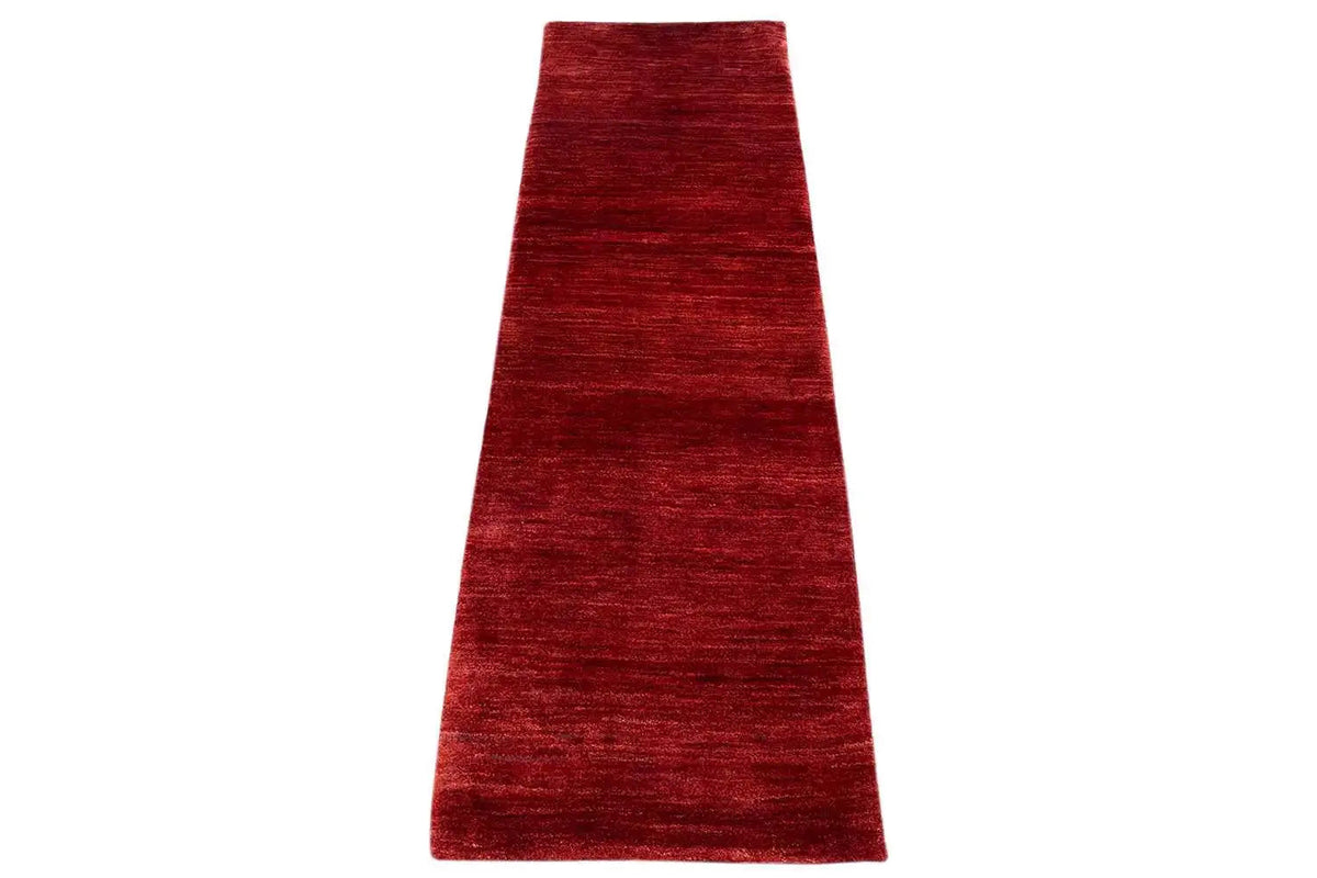 Reddish-brown Gabbeh runner with a fine mottled texture