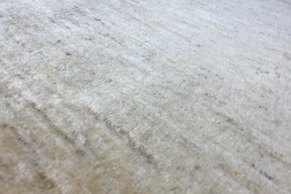 Gabbeh rug 150x101 cm, detail of the sand-colored woven texture with subtle shading