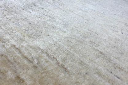 Gabbeh rug 150x101 cm, detail of the sand-colored woven texture with subtle shading