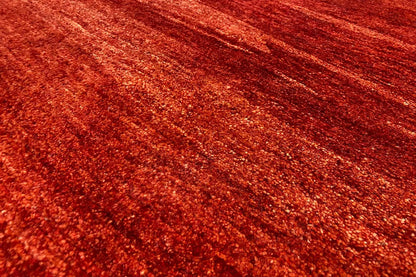 Gabbeh rug 118x82 cm, close-up of the pile surface, red with mottled stripes