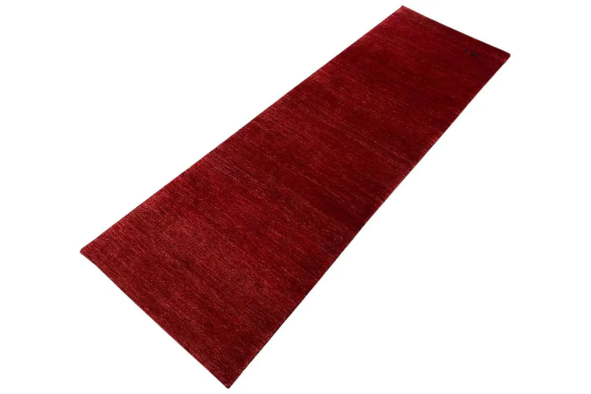Bordeaux-red runner rug with a uniformly textured surface