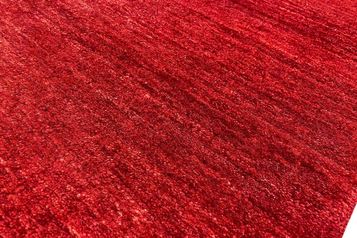 Red carpet pile in detail, mottled and uniform texture