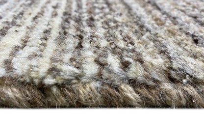 Gabbeh rug detail: short pile, beige-gray with dark knots and stripes