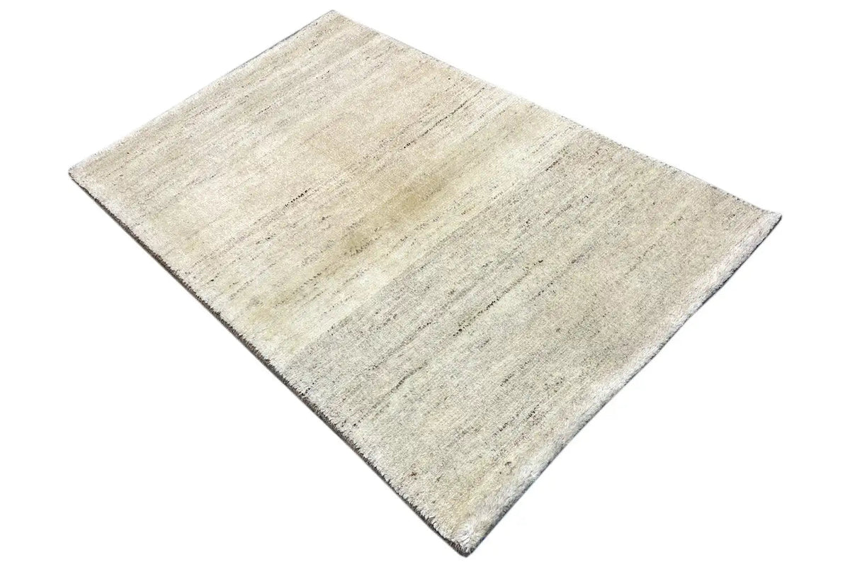 Rug, light beige with an irregular line pattern and a short edge