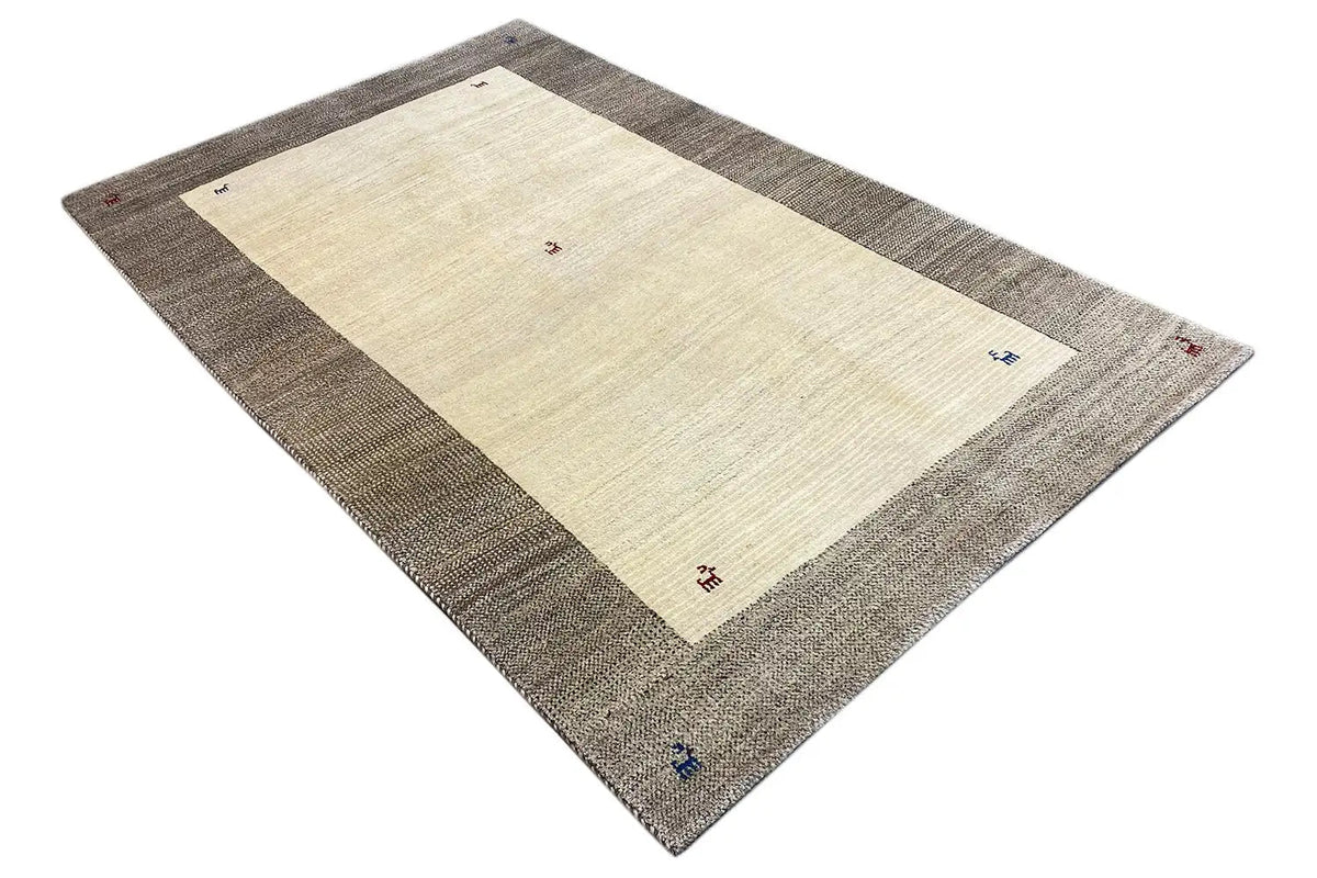 Gabbeh rug with a beige central area, gray border, and small colorful symbols