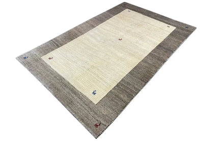 Rug with a beige rectangle in the center, a gray border, and colorful markings