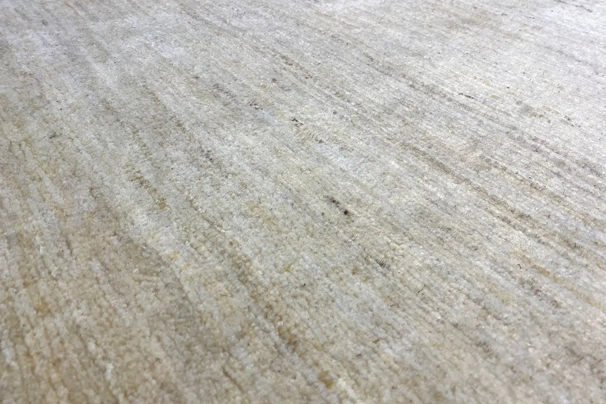 Gabbeh rug surface: light beige pile with a fine, slightly irregular texture