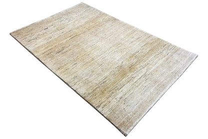 Gabbeh rug (184×118 cm) in a beige shade, diagonal view with edges