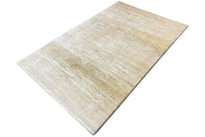 Gabbeh rug (184×118 cm), beige look, viewed from above at an angle with visible weave texture