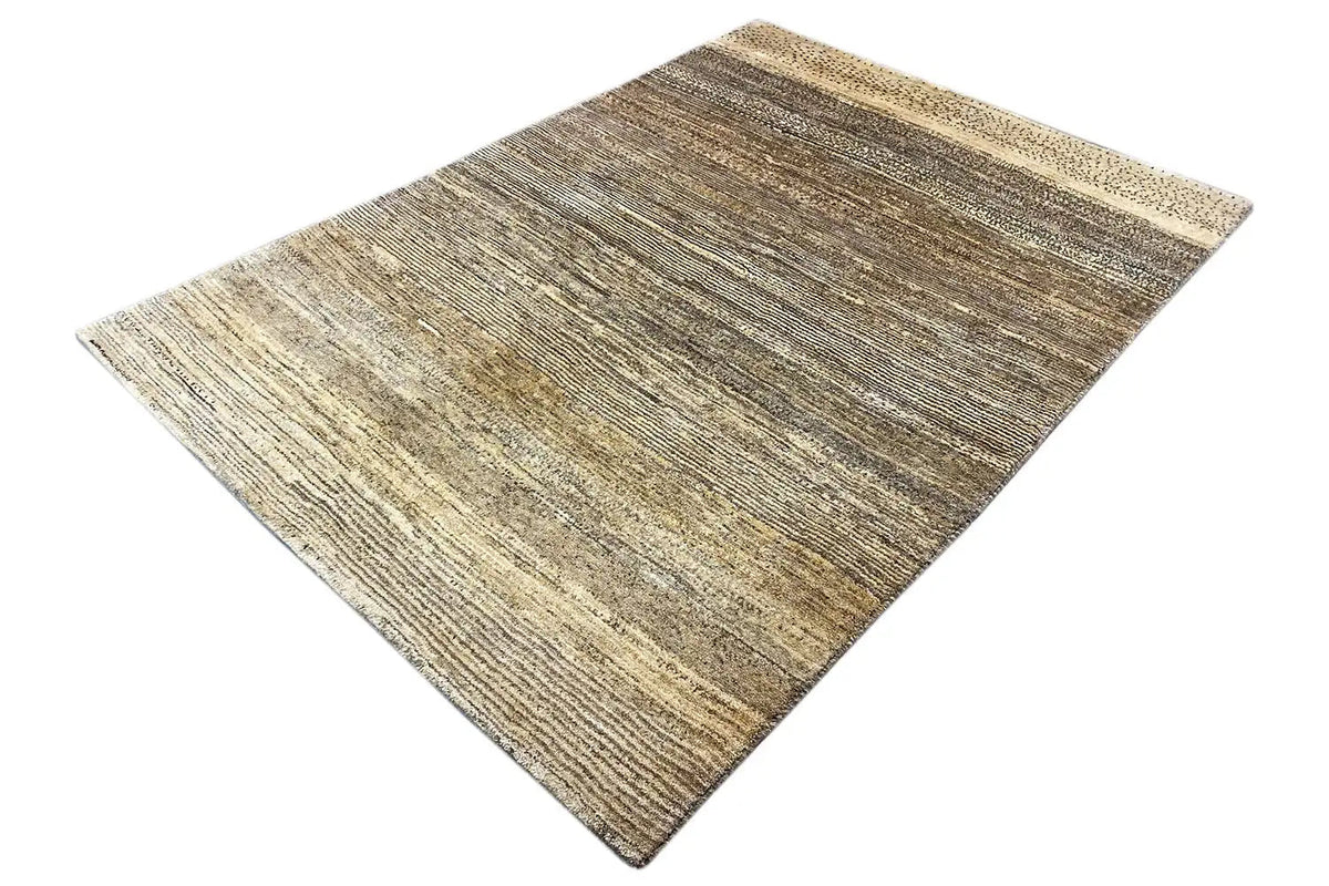 Gabbeh rug in brown and beige tones, angled