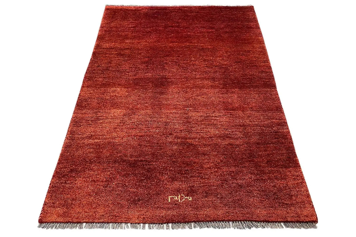 Gabbeh rug (175x114 cm), reddish brown, short pile, fringes along the edges