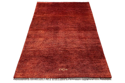 Gabbeh rug (175x114 cm), reddish brown, short pile, fringes along the edges