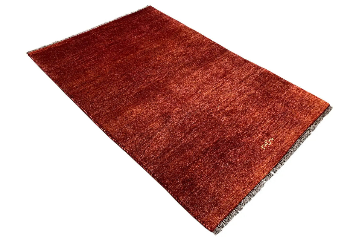 Reddish-brown Gabbeh rug, short pile, fringes along the edges