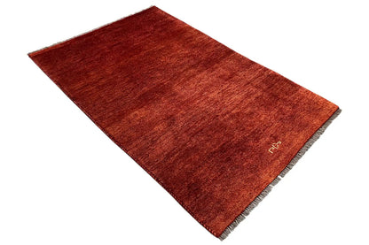 Reddish-brown Gabbeh rug, short pile, fringes along the edges