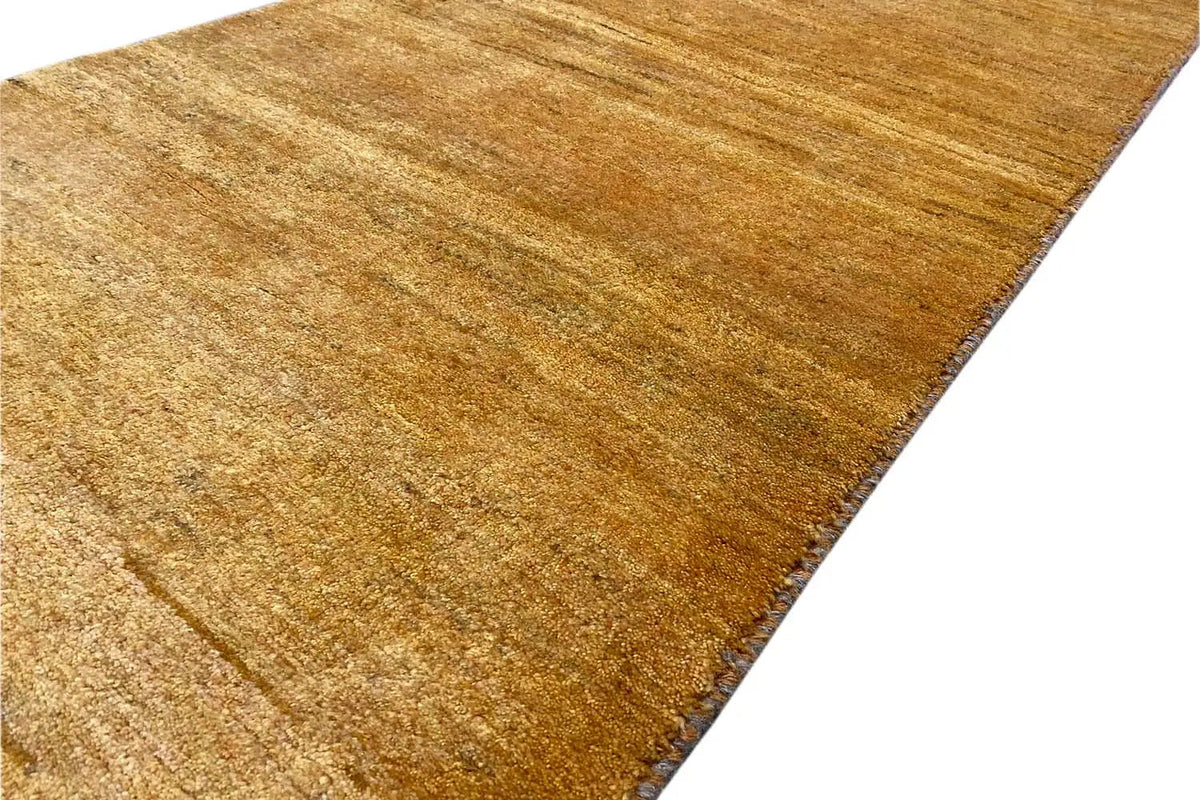 Gabbeh rug 146x70 cm close-up: honey-brown pile texture with fine lines