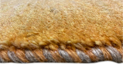 Gabbeh rug 146x70 cm close-up: fringes, honey-brown pile with a dark underside