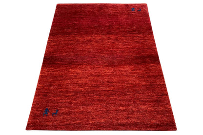 Red carpet with blue ornaments, shown at an angle, 139x100 cm
