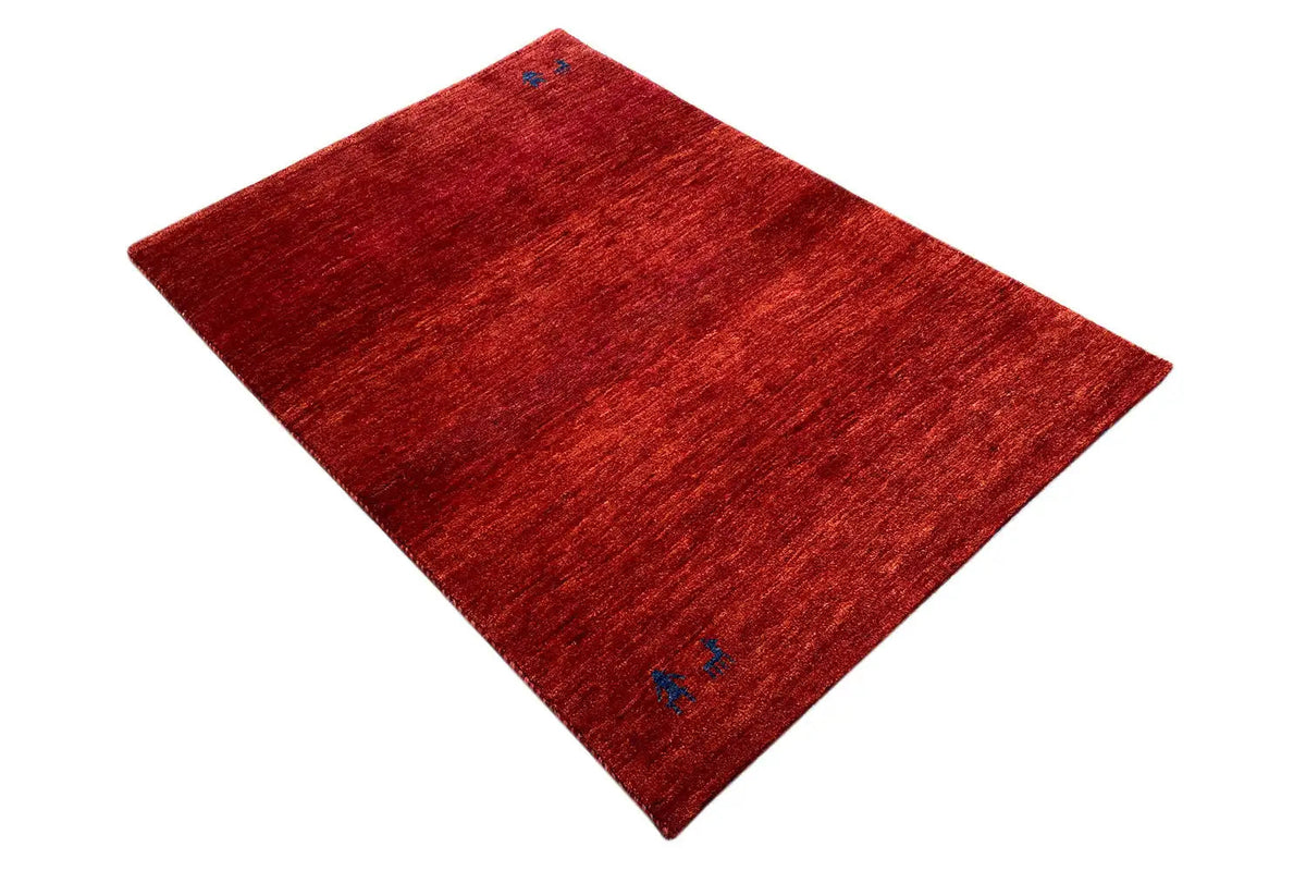 Red Gabbeh rug with blue accents, diagonal view, 139x100 cm