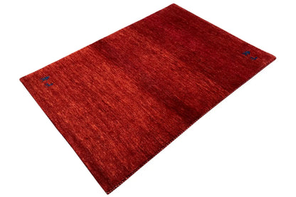 Red carpet with blue ornaments, diagonal view, edges visible