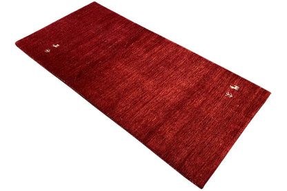 Gabbeh rug 142x69 cm, red rectangle with a white decorative motif, laid diagonally