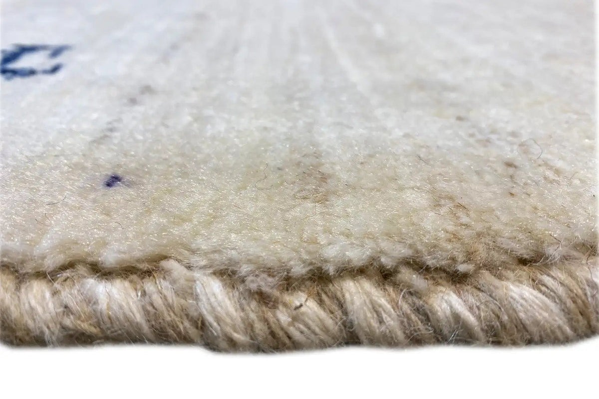 Gabbeh rug: Detail of the pile surface and knotted, thick fringes