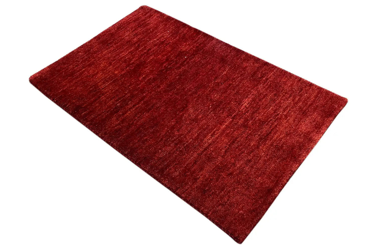 Gabbeh rug, red rug viewed from a diagonal angle, 110x73 cm.