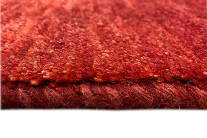 Gabbeh rug, detail of the red pile and finished edge, 110x73 cm.