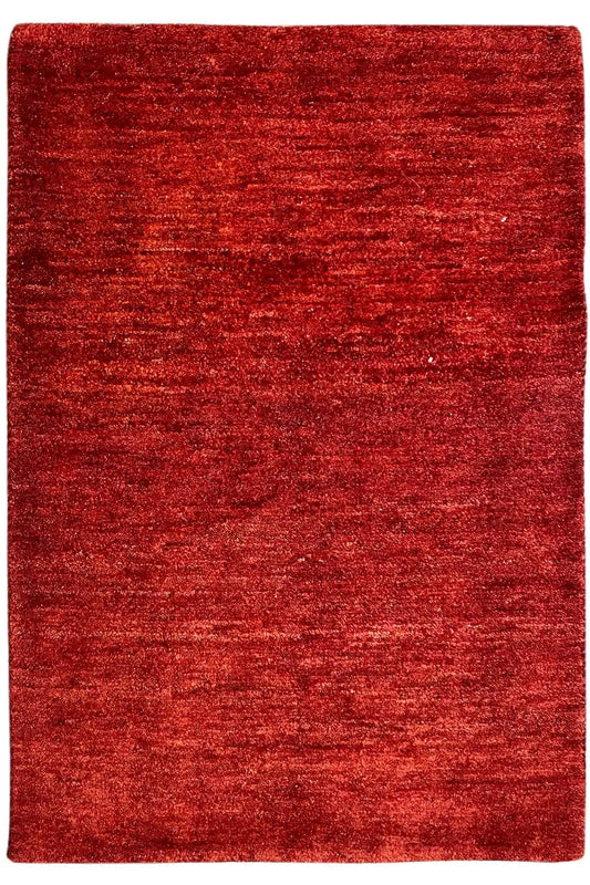 Gabbeh rug, red rectangular rug with a fine texture, approx. 110x73 cm.