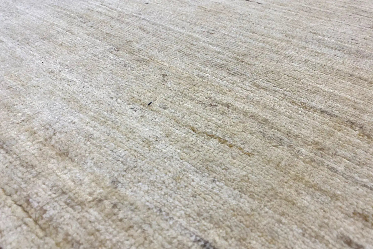 Detail of the beige Gabbeh weave structure with an even grain pattern