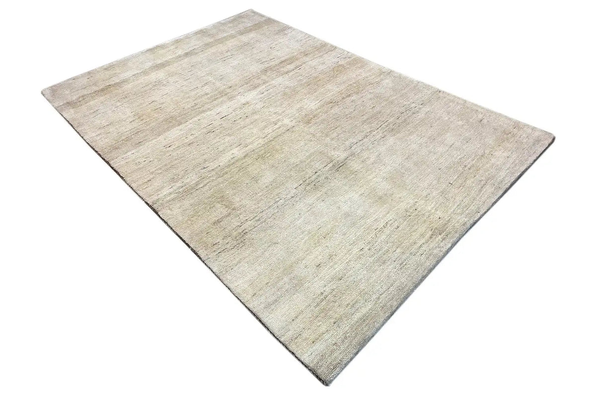 Gabbeh rug, light beige with a subtle texture, laid flat (top view)