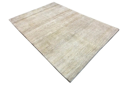 Gabbeh rug, light beige with a subtle texture, laid flat (top view)