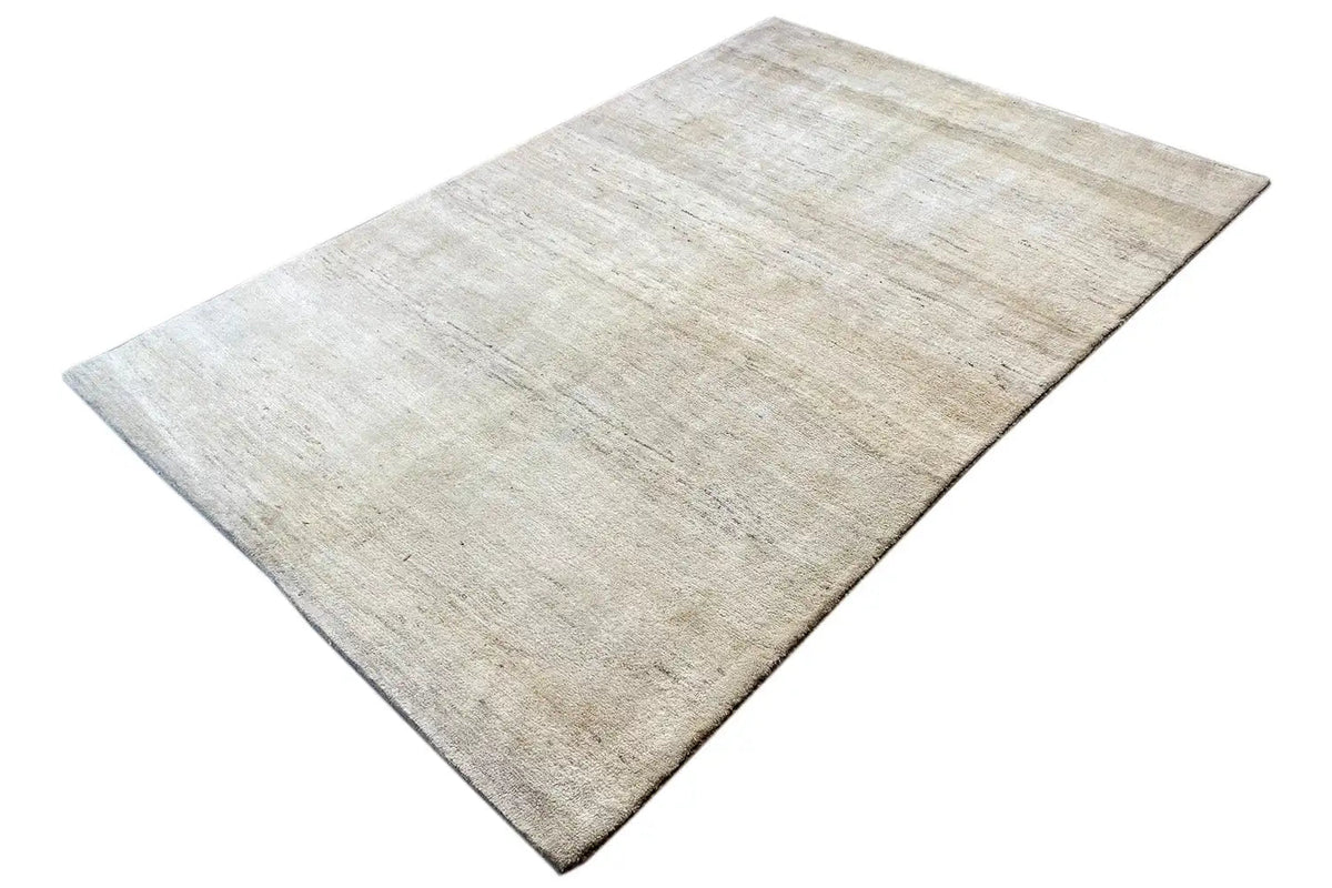 Gabbeh rug, light beige background with a fine pattern, laid flat