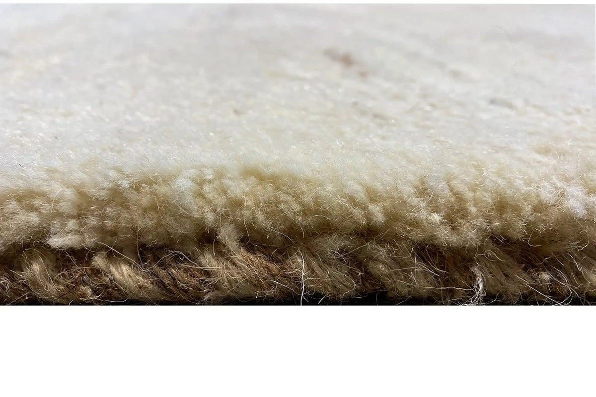 Gabbeh rug with a light pile and dense texture, close-up of the edge