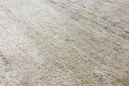 Gabbeh rug, fine pile texture in light beige with a subtle gray tone