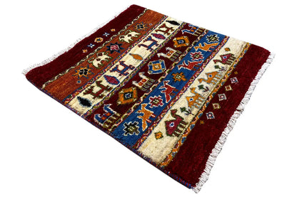 Gabbeh-Lori rug, burgundy border, light areas with colorful ornaments, fringes